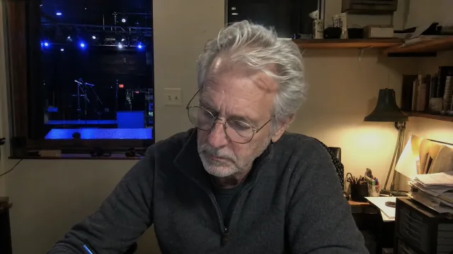 A venue owner taking notes during the conference